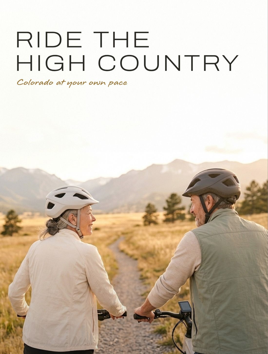A couple in white and charcoal helmets smiling at each other beside their e-bikes in a golden mountain meadow, with the headline “Ride the high country” and the script line “Colorado at your own pace”